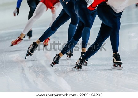 male skaters legs run mass start speed skating competition, winter sports games