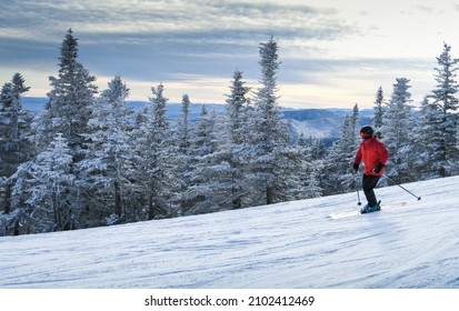 Male Skier In Red Jacket Enjoy Skiing During Winter Vacation At Stowe Mountain Resort In Vermont. Active Lifestyle Concept.