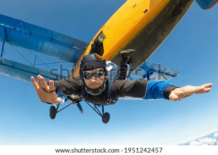 Male skydiver jumps from the aircraft