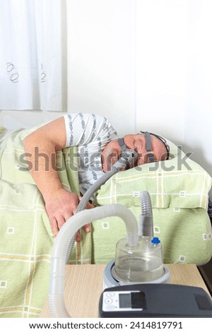 Similar – Caregiver checking blood pressure to a senior woman