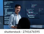 Male software engineer presenting a Coding Task, AI chatbot workflow with code on multiple monitors in a modern office. coding collaboration and agile projects Concept.