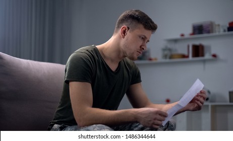 Male Soldier Reading Letter From Family, Armed Forces Duty, Feeling Support