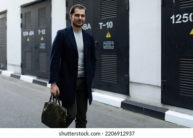 Male Sole Proprietor Heading To Work With A Briefcase In His Hands.