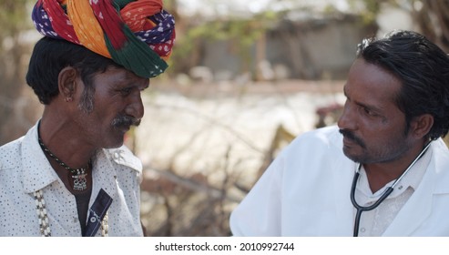 A Male South Asian Doctor Doing A Checkup On An Elder Male