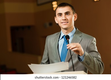 Male Speaker Looks Into The Room And Said Into The Microphone, Speech At The Conference