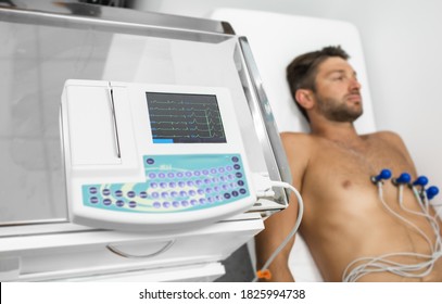 Male sportsman getting modern heart diagnostic, heart rate measurement, bradycardia