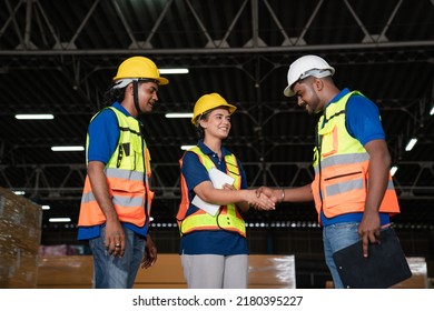 Male Staff Workers Shaking Hands With Deals In Warehouse, Success Collaboration Concept, Teamwork.