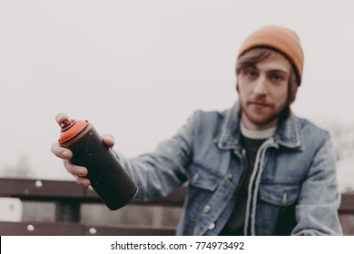 male street artist holding can with spray paint - Powered by Shutterstock