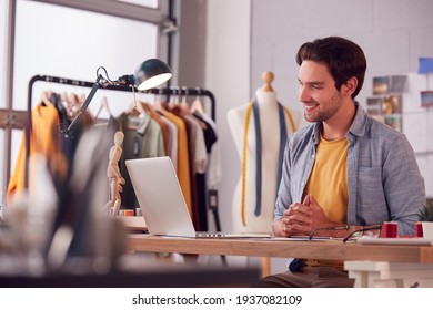 Male Student Or Business Owner Working In Fashion Using Laptop For Video Call In Studio - Powered by Shutterstock