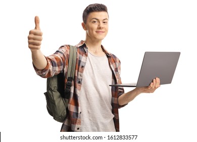 Male Student Gesturing A Thumb Up And Holding A Laptop Computer Isolated On White Background