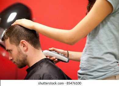 Male Student Having A Haircut With A Hair Clippers