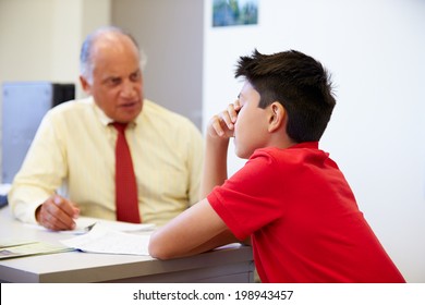 Male Student Talking To High School Counselor