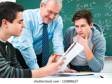 Male Students With A Teacher In Classroom