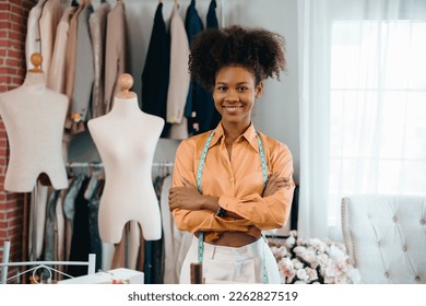 Male stylist Successful Fashion Business. Portrait of Smiling Black Designer stylish standing and working at fashion studio.Portrait of fashion designer in office.