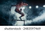 Male Super Athlete Runner in Mid-leap Over Hurdle, Captured in Dramatic Lighting and Smoke. Intense Focus, Agility, and Strength in High-energy Track and Field Event.