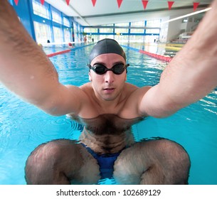 Male Swimmer Getting Ready For A Backflip In Swimming Pool