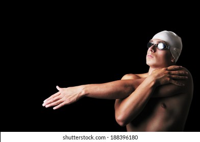 Male swimmer isolated on black - Powered by Shutterstock