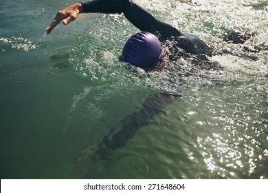 Male Swimmer Swimming In Open Water. Athlete Practicing For The Competition.