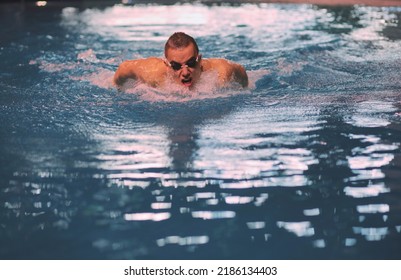 Male Swimmer At The Swimming Pool. Underwater Photo. Male Swimmer.