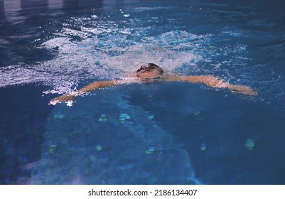 Male Swimmer At The Swimming Pool. Underwater Photo. Male Swimmer.