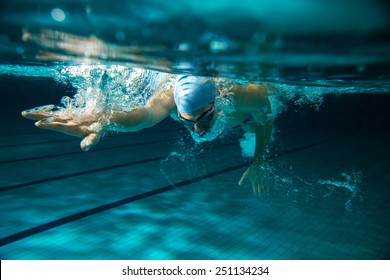 Male Swimmer At The Swimming Pool.Underwater Photo.