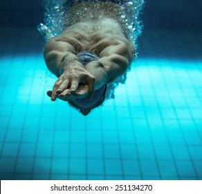 Male Swimmer At The Swimming Pool.Underwater Photo.