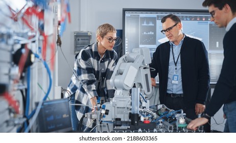 Male Teacher Attentively Listening Opinion of His Smart Students During Lesson at University. People Discussing Robotic Prototype of Hand. Computer Science Education Concept - Powered by Shutterstock