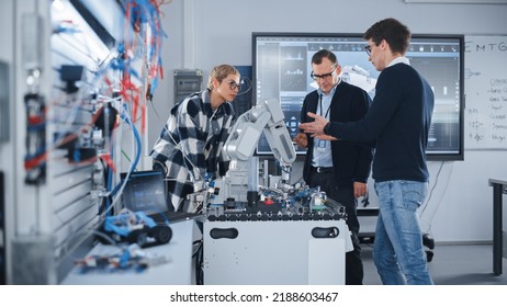 Male Teacher Attentively Listening Opinion His Smart Students During Lesson at University  People Discussing Robotic Prototype Hand  Computer Science Education Concept