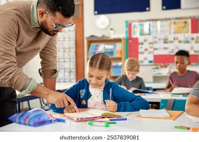 Male teacher in classroom helping schoolgirl for studying at desk. Little girl in classroom asking for help in solving sums. Teacher helping primary students in understanding concept. - Powered by Shutterstock