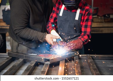 Male Teacher Master Class Welding And Work Student Of Technical School. Industrial Education Concept.