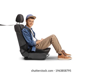 Male Teenager Sitting In A Carseat With A Seatbelt Isolated On White Background