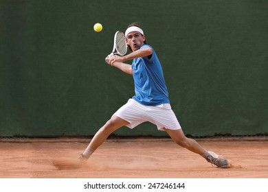 Male Tennis Player In Action