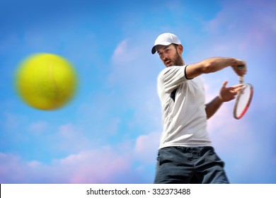 Male Tennis Player In Action