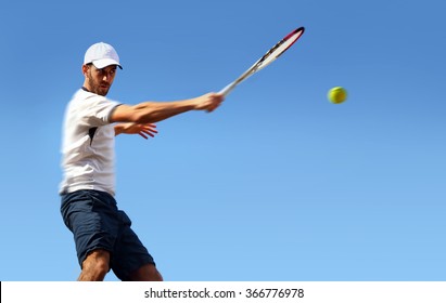 Male Tennis Player In Action 