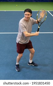 Male Tennis Player Concentrated On Game. Man Waits For The Pitch To Hit The Ball Back