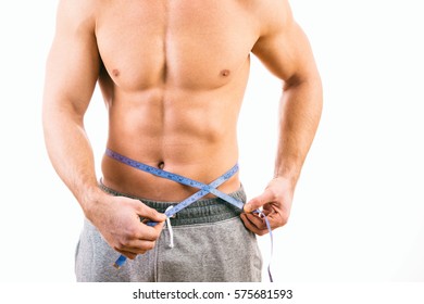 Male Torso And Blue Tape Measure On White Background