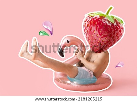 Male tourist with ripe strawberry instead of his head and inflatable ring on pink background