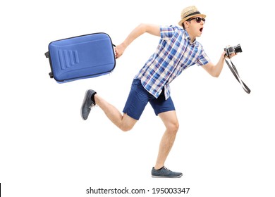 Male Tourist Rushing With His Baggage And Camera In Hand Isolated On White Background