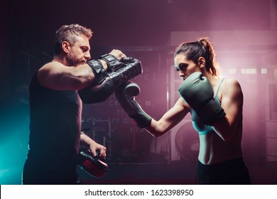male trainer gives self-defense classes to female fighter - uppercut long, boxing, training