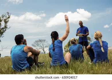 Male Trainer Taking Attendance In The Bootcamp