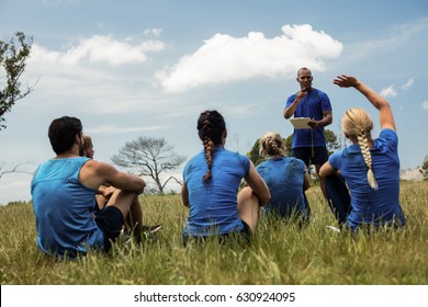 Male Trainer Taking Attendance In The Bootcamp