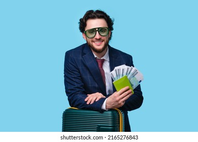 Male Traveler Tourist holds Fan Cash Currency Euro Banknotes on Passport. Pleased Bearded Man in Official Suit and Green Sunwear Traveling on Vacation Trip. Air Flight Business Class Journey