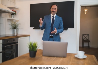 Male Tutor Presenting Something To The Onlinde Audience