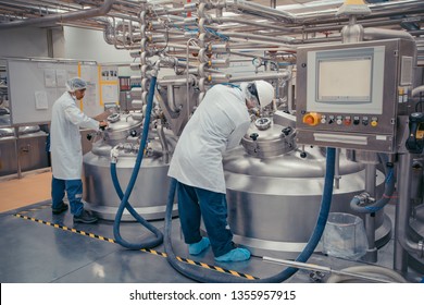 Male Two Work The Process Of Cream Cosmetic Fermentation At The Manufacturing With Stainless Tank On The Background