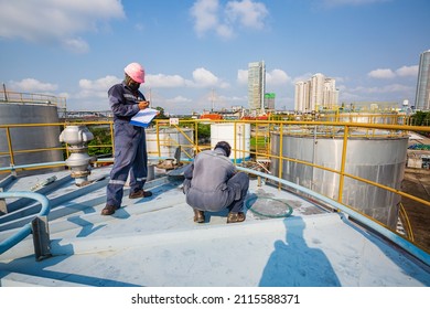 Male Two Worker Are For Inspection Ultrasonic Thickness Roof Plate Dome Top Of Storage Tank.