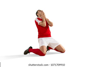 The male unhappy soccer or football player with palm on his face after goal. The professional soccer football and human emotions concept. The fit caucasian active man isolated on white studio