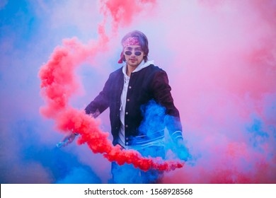 Male Urban Dancer With Colored Smoke