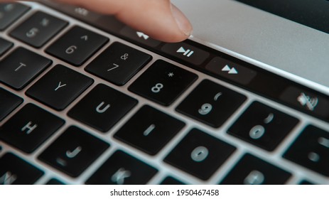 Male User Using The Pause Key On The Laptop.