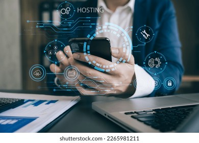 Male using tablet, computer and presses his finger on the virtual screen inscription Hosting on desk, Web hosting concept, Internet, business, digital technology concept.