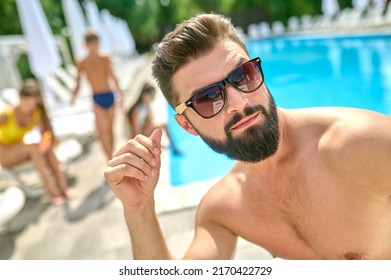 Male Vacationer Taking A Selfie At The Resort